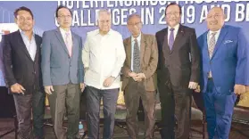  ??  ?? (From left) The author, Foundation for Economic Freedom president Calixto Chikiamco, former Foreign Affairs secretary Albert del Rosario, Dr. Raul Fabella, Philippine Chamber of Commerce and Industry chairman George Barcelon and Stratbase founder and managing director Victor Andres Manhit.
