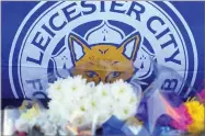  ?? AP PHOTO BY RUI VIEIRA ?? Tributes are placed outside Leicester City Football Club, Leicester, England, Monday Oct. 29, after a helicopter crashed in flames Saturday.