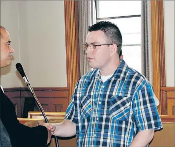  ?? — Photo by Rosie Gillingham/the Telegram ?? Jason Gordon Skanes (right) shakes hands with his lawyer, Ken Mahoney, after Skanes was sentenced in Newfoundla­nd Supreme Court in St. John’s Friday.