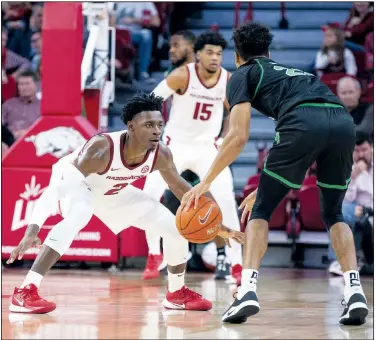  ?? File photo/Special to NWA Democrat Gazette/DAVID BEACH ?? Arkansas’ Adrio Bailey (2) defends against North Texas’ Larry Wise on Tuesday at Bud Walton Arena in Fayettevil­le. Arkansas held North Texas to 2 of 17 on three-pointers in the win.