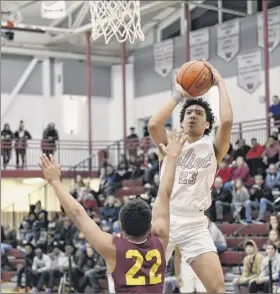  ?? Hans Pennink / Special to the times union ?? messiah mallory, who led Watervliet with 21 points and 10 rebounds, shoots over rodney Parker of Bishop Gibbons in their sectional matchup.