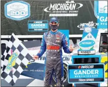  ??  ?? Zane Smith celebrates his victory after a NASCAR Truck Series auto race at Michigan Internatio­nal Speedway in Brooklyn, Michigan, on Aug 7. (AP)
