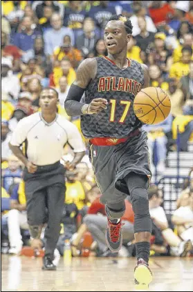  ?? JOHN MINCHILLO / AP ?? Hawks guard Dennis Schroder sought out teammate Kyle Korver in California this summer for nearly two weeks of instructio­n on his shots and additional workouts at the famed P3 facility.