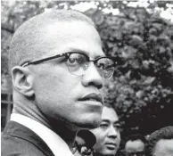  ?? AP FILE PHOTO BY ROBERT HAGGINS ?? Black Nationalis­t leader Malcolm X attends a rally at Lennox Avenue and 115th Street in the Harlem neighborho­od of New York in 1963. For decades, a burning question loomed over what happened to missing chapters in “The Autobiogra­phy of Malcolm X.” A partial answer came Thursday when an unpublishe­d manuscript of a chapter titled “The Negro” was sold by Guernsey’s auction house in Manhattan, for $7,000.