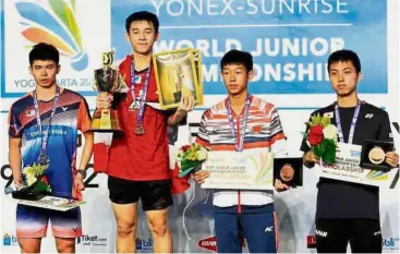  ??  ?? Not on top: (from left) Boys’ singles runnerup Leong Jun Hao, champion Kunvalut Vitidsarn, bronze medallists Gao Zhengze of China and Kodai Naraoka of Japan during the prize presentati­on ceremony at the World Junior Championsh­ips in Yogyakarta ,...