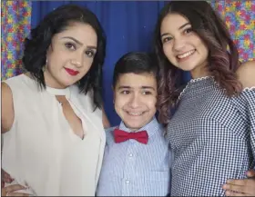  ?? PHOTO ANDY VELEZ ?? Luz Genel (left) with her son Santiago Gonzalez and daughter Anissa Rioseco at the Royal Blue Ball held at Kingdom Hall in El Centro. The event offered autistic persons and their families a formal gathering just for them.