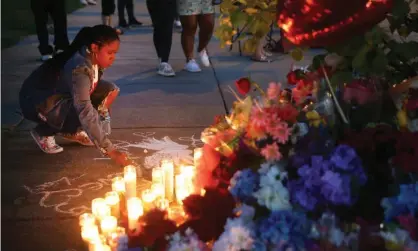  ?? ?? A makeshift memorial outside Tops market after the shooting in Buffalo, New York. Photograph: Scott Olson/Getty Images