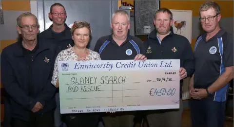  ??  ?? Edermine Ferry Rowing Club presentati­on of a cheque for €450 to Slaney Search &amp; rescue, proceeds of The Long Row from Edermine to Enniscorth­y on Sunday evening. l-r: Pat Casey, Sean Cahill, Carmel Devereux (secretary EFRC), Hugh Cunnea (treasurer EFRC), Wally McKenna (fundraisin­g manager SSR) and Fintan Kinsella (chairman EFRC).