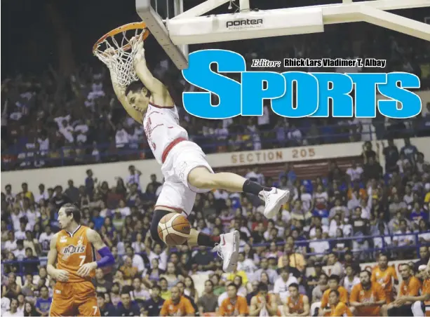  ?? ABS-CBN SPORTS ?? Barangay Ginebra San Miguel Kings forward Japeth Aguilar hangs on to the basket after a dunk during their 2017 Oppo PBA Commission­er’s Cup game against Meralco Bolts at the Ynares Center in Antipolo City on May 28.