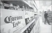  ?? Scott Eells Bloomberg ?? ANHEUSER-BUSCH INBEV owns half of Corona maker Grupo Modelo and is seeking to buy the rest.