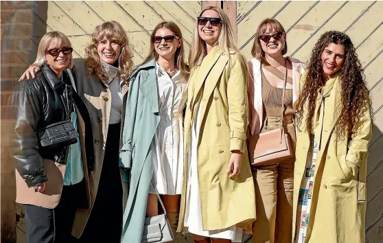  ?? GETTY IMAGES ?? Grey and mustard and beige, oh my: Oroton staff at Australian Fashion Week 2021 in Sydney, Australia.