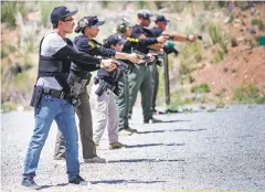  ?? GABRIELA CAMPOS/THE NEW MEXICAN ?? SFPD pre-academy cadets take part in firearm drills Wednesday. The group of six began training April 8 and will continue to hone their skills in the classroom, on the range and through hands-on exercises before entering the New Mexico Law Enforcemen­t Academy.