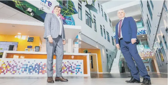  ??  ?? Igor Kotsiuba, from Healthymit­y, left, with Patrick Melia, Sunderland City Council chief executive, at the Sunderland Software Centre.