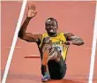  ?? FOTO: DPA ?? Am Boden: Usain Bolt im 4x100-mRennen