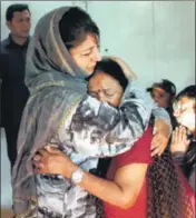  ?? PTI ?? J&K chief minister Mehbooba Mufti consoles an Amarnath pilgrim who survived the militant attack, in Srinagar on Tuesday.