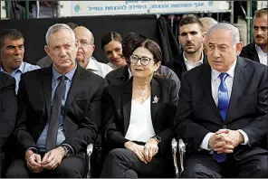  ?? AP/ARIEL SCHALIT ?? Blue and White party leader Benny Gantz (left), Esther Hayut, chief justice of the Supreme Court of Israel, and Prime Minister Benjamin Netanyahu attend a memorial service Thursday for former President Shimon Peres in Jerusalem.