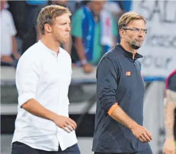  ?? FOTO: DPA ?? Für Julian Nagelsmann (li.) und Jürgen Klopp geht es auch um Geld und die Zukunft ihres Kaders.