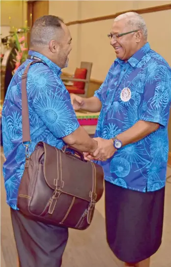  ?? Photo: DEPTFO News ?? Prime Minister Voreqe Bainimaram­a greets Fijian High Commission­er to New Zealand Filimoni Waqabaca at the Grand Pacific Hotel on April 6, 2017.