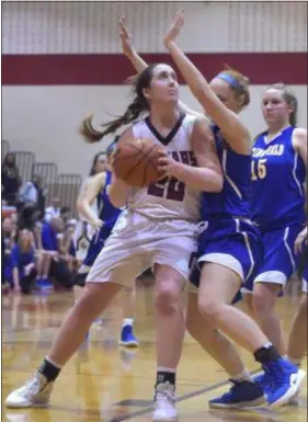  ?? PETE BANNAN — DIGITAL FIRST MEDIA ?? Garnet Valley senior Emily McAteer goes to the net in the fourth quarter against Springfiel­d. McAteer scored a game-high 27 points in a 57-52 win for Garnet Valley in Wednesday’s Central League final.