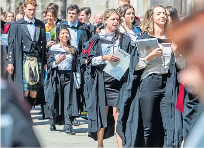  ?? Picture: Steven Brown. ?? St Andrews University graduates. The institutio­n was one of the four ancient universiti­es with a surplus while many more modern ones are in deficit this year.
