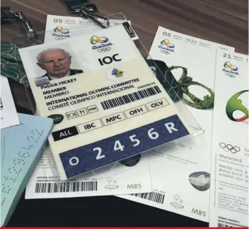  ??  ?? Documents belonging to Ireland’s Patrick Hickey, a member of the Internatio­nal Olympic Committee’s executive board, that include his Olympics’ credential and passport are displayed alongside Olympic tickets during a police press conference in Rio de...