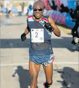  ?? Picture: GALLO IMAGES ?? FIRST MAN: Stephen Mokoka crosses the line to win the ASA Half-Marathon Championsh­ips