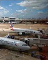  ?? KIICHIRO SATO/ASSOCIATED PRESS ?? American Airlines planes parked at Dallas-Fort Worth Internatio­nal Airport in 2018.