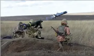  ?? UKRAINIAN DEFENSE MINISTRY PRESS SERVICE VIA AP ?? In this image taken from footage provided by the Ukrainian Defense Ministry Press Service, a Ukrainian soldiers use a launcher with US Javelin missiles during military exercises in Donetsk region of Ukraine on Wednesday. President Joe Biden has warned Russia’s Vladimir Putin that the U.S. could impose new sanctions against Russia if it takes further military action against Ukraine.