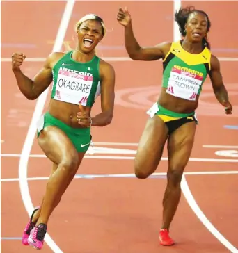  ?? Photo: Getty Images ?? Blessing Okagbare of Nigeria (L) crosses the line to win gold ahead of silver medalist Veronica Campbell-Brown of Jamaica (R) in the Women's 100m final at Hampden Park during the Glasgow 2014 Commonweal­th Games on July 28, 2014 in Glasgow.