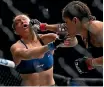  ?? GETTY IMAGES ?? Ronda Rousey winces after a punch to the face yesterday.