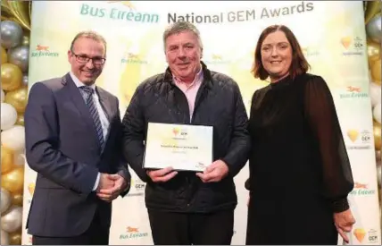  ??  ?? Caillian Ellis is pictured receiving his award from CEO, Stephen Kent and Chief Schools Officer, Miriam Flynn