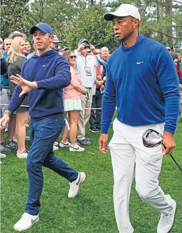  ?? ?? WEDGE DRIVEN BETWEEN THEM: It appears McIlroy and Woods do not see eye to eye.