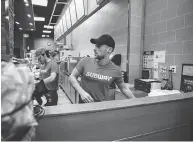  ?? SAM HODGSON / THE NEW YORK TIMES ?? Faced with a staff shortage, Jeffrey Kaplow works behind the counter at his Subway restaurant in New York.