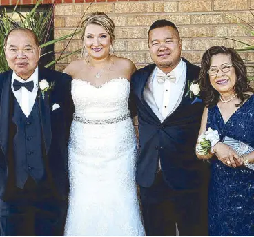  ??  ?? Newlyweds Keith and Lesia Pua with the parents of the groom Phillip and Nayds Pua