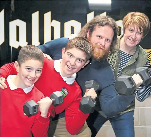 ?? ?? GAMES BACKER: Brett Hampton at his Valhalla Gym with Lorna Cochrane and her sons Marshall, 8, and Alex, 11. Picture by Gareth Jennings.