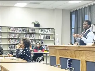  ?? Tamara Johnson • Times-Herald ?? Forrest City School District Assistant Superinten­dent Dr. Zrano Bowles speaks to board members during their meeting Thursday night about the possible constructi­on of a new wellness center on the junior high campus, with an estimated cost of about $2.7 million. The board agreed to allow superinten­dent Dr. Tiffany Hardrick to spend up to $20,000 with an architect for the project that would need final approval by the board.