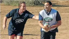  ?? Picture: Supplied ?? Former All Blacks scrumhalf Justin Marshall, despite some restricted movement, catches former Bok wing Bryan Habana in possession during a touch rugby match this week with bush rangers at the Kwandwe Reserve in the Eastern Cape.