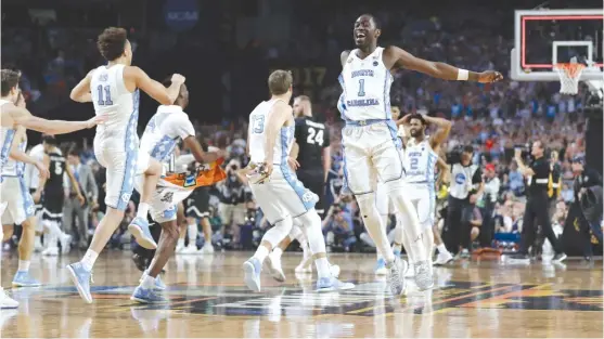  ?? | AP ?? North Carolina players celebrate after defeating Gonzaga in the NCAA championsh­ip game Monday in Glendale, Ariz. The Tar Heels scored the last eight points of the game.