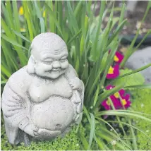  ??  ?? Left, below: A Buddha statue nestles in grasses by the pond.