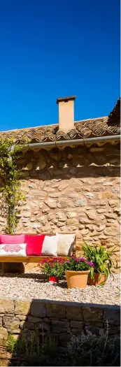  ??  ?? Top Left: Entrance to the Son Balagueret villa. Bottom
Left: Lounge room in Son Balagueret villa. Top Right: outdoor lounge. Bottom Right: Outdoor lunch at Son Balagueret villa in Mallorca.