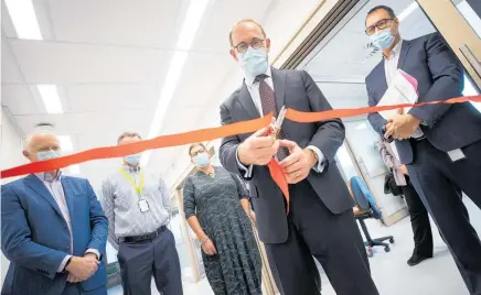  ?? Photo / George Heard ?? Health Minister Andrew Little opens a new intensive care unit in Christchur­ch. But there should be much more building, and lots more action to restore the health system.