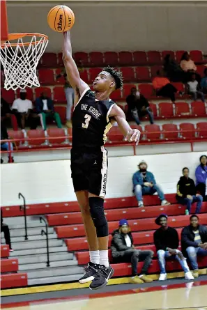  ?? Photo by Kevin Sutton ?? ■ Pleasant Grove’s T’vondrick Henry goes up for a dunk on Tuesday at Razorback Gym. Arkansas High defeated the Hawks, 81-65.