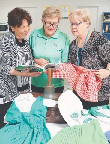  ?? Picture: JUSTIN BRIERTY ?? GREAT MEMORIES: St Joseph’s teacher and former student Grace Kinloch, Sandra Casey and teacher and former student Kerry Yelavich prepare for the school’s 90th anniversar­y.