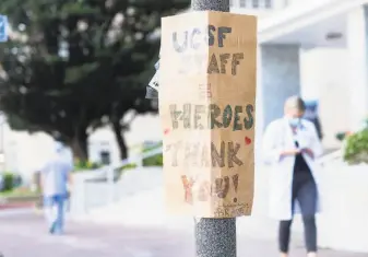  ??  ?? A sign outside of the Parnassus Avenue medical center thanks the UCSF staff. UCSF physicians have turned to social media to help educate the public about the COVID19 pandemic.