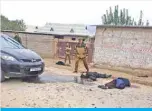  ??  ?? DUSHANBE: Police investigat­ors work at the site of an attack at the Ishkobod border post located some 50 kilometers west of the Tajikistan capital Dushanbe. — AFP