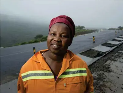  ??  ?? Nontembeko Khenku is building sidewalks and running her small business thanks to SANRAL.
