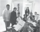  ??  ?? Hon. Jose Espinosa III, Mayor of Iloilo City, helped distribute the Maybank tokens to R.I.S.E. participan­ts as Maybank CEO Shahril Azuar Jimin looks on.