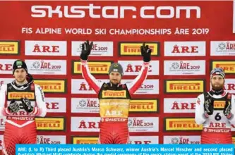 ?? — AFP ?? ARE: (L to R) Third placed Austria’s Marco Schwarz, winner Austria’s Marcel Hirscher and second placed Austria’s Michael Matt celebrate during the medal ceremony of the men’s slalom event at the 2019 FIS Alpine Ski World Championsh­ips at the National Arena in Are, Sweden, yesterday.