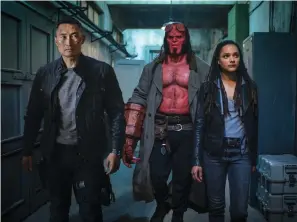  ?? Associated Press ?? ■ This image released by Lionsgate shows Daniel Dae Kim, left, David Harbour and Sasha Lane in a scene from “Hellboy.”