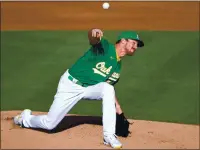  ?? DOUG DURAN — STAFF PHOTOGRAPH­ER ?? Chris Bassitt was lucky enough to be pitching the day that A’s family members announced the lineup from the Coliseum.